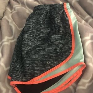 patterned black orange & green nike shorts